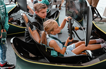 A young fan testing out the racing simulator