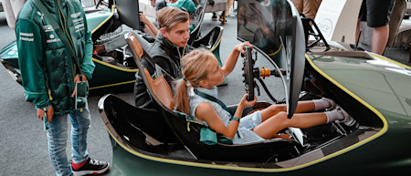 A young fan testing out the racing simulator