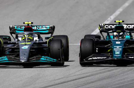 Sebastian goes wheel-to-wheel with Lewis Hamilton into Turn One
