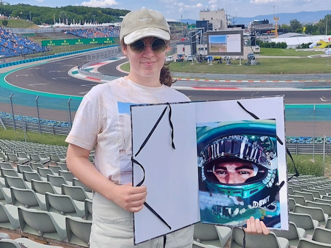 Réka at the track with her artwork of Lance