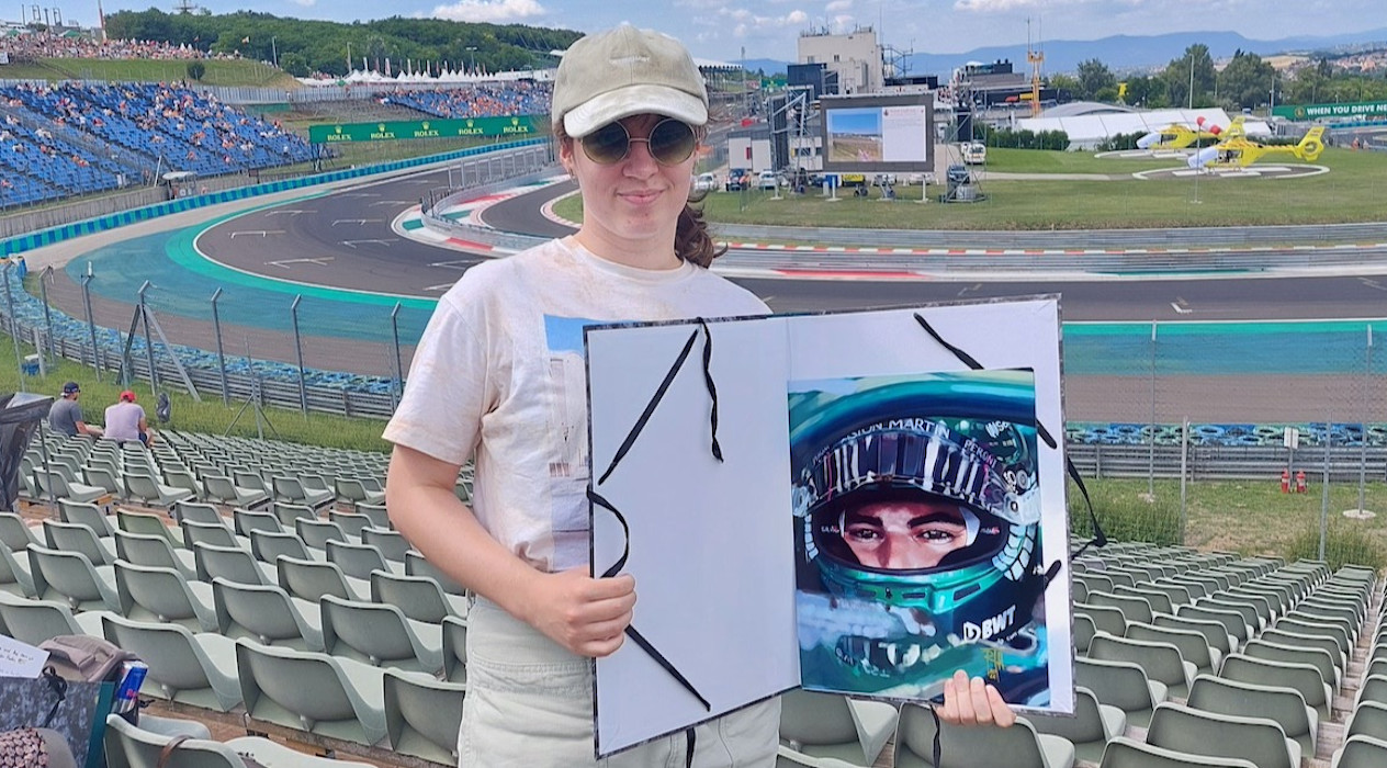 Réka at the track with her artwork of Lance