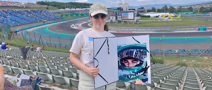 Réka at the track with her artwork of Lance 
