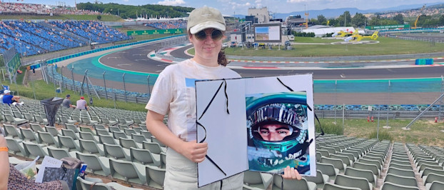 Réka at the track with her artwork of Lance 