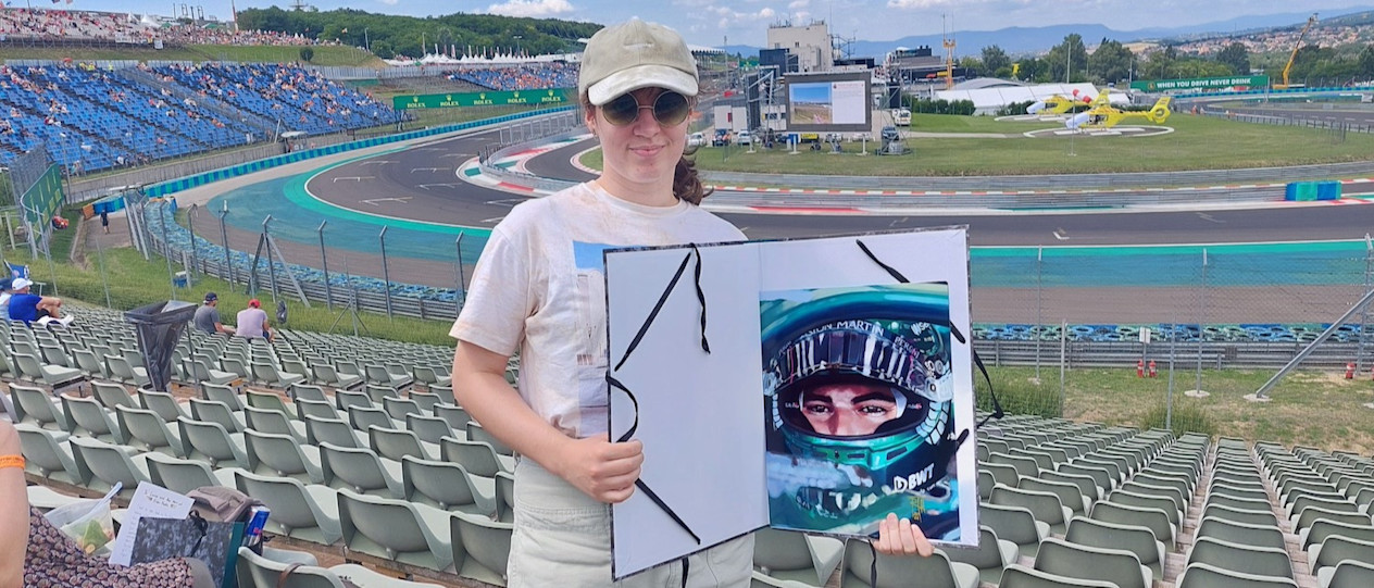Réka at the track with her artwork of Lance 