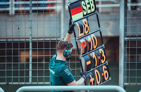 Keeping Seb up to date on the battle around him on track.