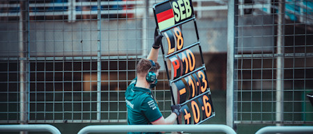 Keeping Seb up to date on the battle around him on track.