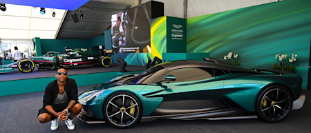 TV Presenter Reggie Yates poses with the Aston Martin Valhalla