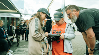 An unforgettable moment. Jozef gets his hands on the steering wheel of an Aston Martin Aramco F1 car.