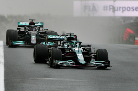 Lance fends off Lewis Hamilton during the opening stint of the race