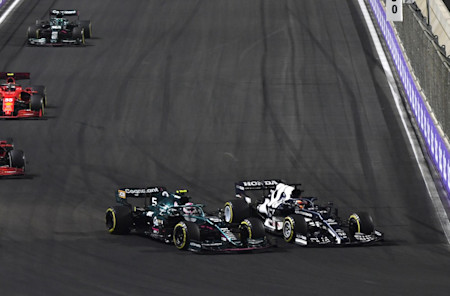 Sebastian holds off Yuki Tsunoda, who later collided with Sebastian
