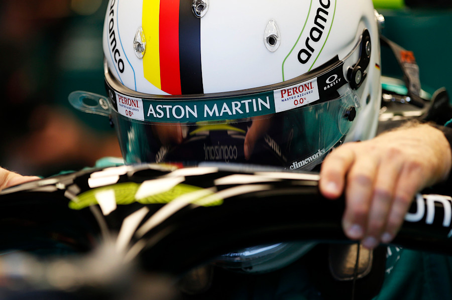 Sebastian climbs into his AMR22 ahead of practice at Monaco