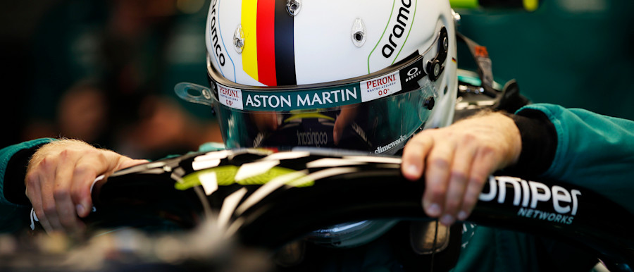 Sebastian climbs into his AMR22 ahead of practice at Monaco
