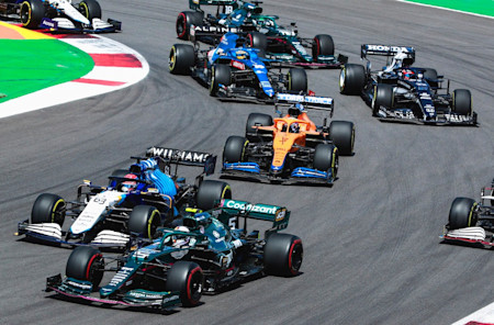 Sebastian battles George Russell at the start of the race