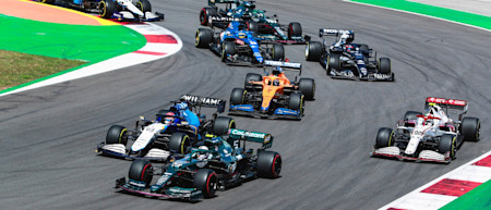 Sebastian battles George Russell at the start of the race