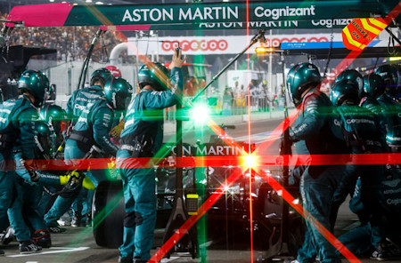The team completes an in-race pitstop under the lights in Qatar.