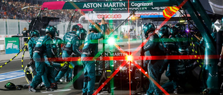 The team completes an in-race pitstop under the lights in Qatar.