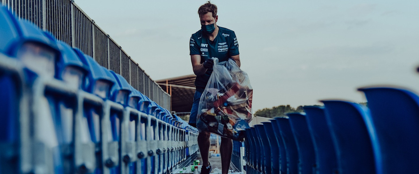 Sebastian picks up litter following the British Grand Prix
