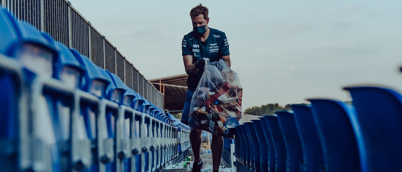Sebastian picks up litter following the British Grand Prix