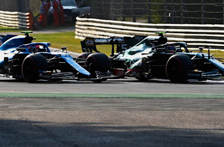 Sebastian makes a move on Esteban Ocon in the Grand Prix