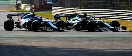 Sebastian makes a move on Esteban Ocon in the Grand Prix
