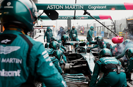 A team member watches on during pitstop practice