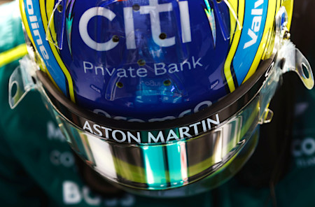 Fernando climbs into the cockpit of the AMR24
