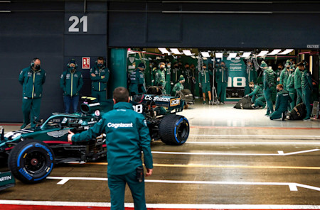 The team watches on as the AMR21 takes to the track
