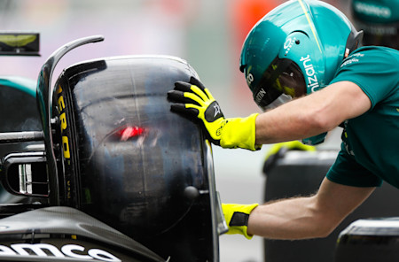 The team runs through a pitstop in practice
