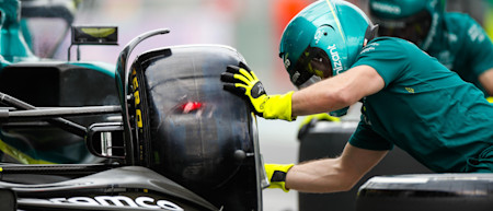 The team runs through a pitstop in practice