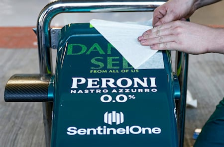 The AMR22, as well as the garage floor and walls, featured 'Danke Seb' branding that included the names of 400 I / AM members.