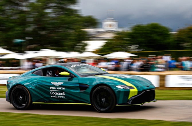 The Safety Car speeds past onlookers