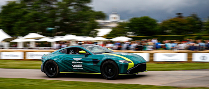 The Safety Car speeds past onlookers