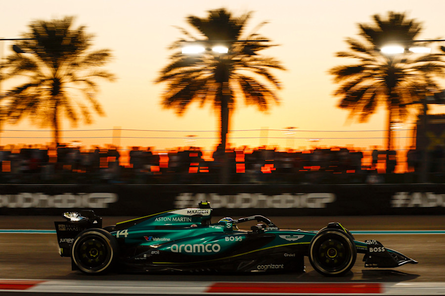 Fernando in the AMR24 as the sun sets during the race