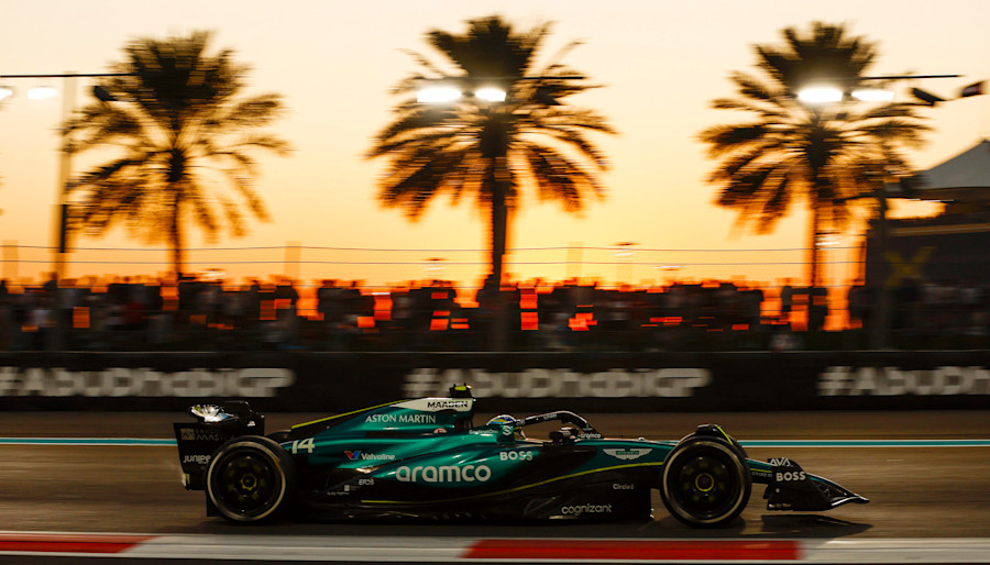 Fernando in the AMR24 as the sun sets during the race
