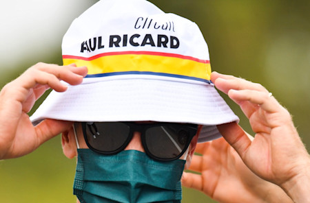 Sebastian wears the bucket hat as he heads to the garage