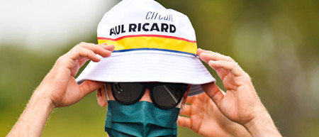 Sebastian wears the bucket hat as he heads to the garage