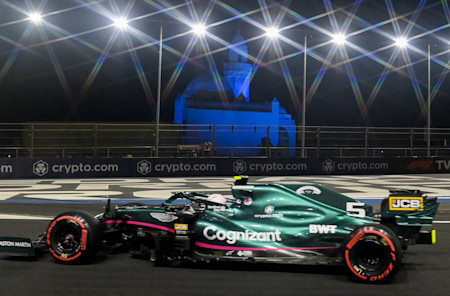 Passing the floodlights as the team tries to battle back in the race