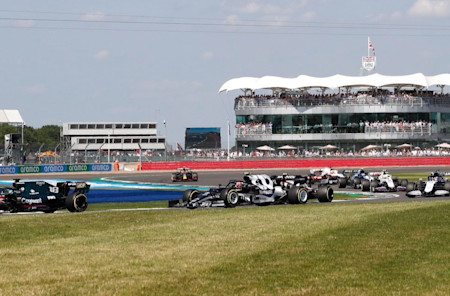 Lance attempts to break clear of a DRS train in the British Grand Prix