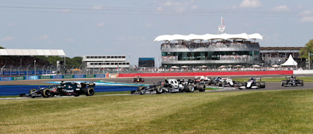 Lance attempts to break clear of a DRS train in the British Grand Prix