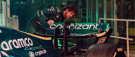 Sebastian Vettel closely examines the AMR22 following its global reveal 