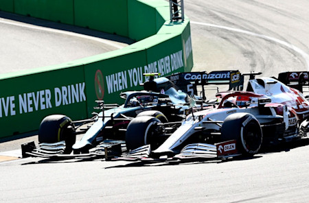 Sebastian Vettel goes wheel-to-wheel with Alfa Romeo stand-in Robert Kubica