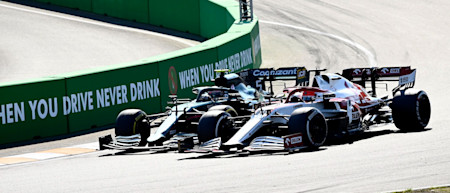 Sebastian Vettel goes wheel-to-wheel with Alfa Romeo stand-in Robert Kubica 