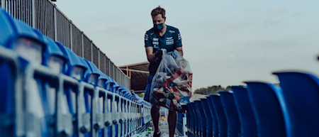 Sebastian picks litter following the British Grand Prix on Sunday