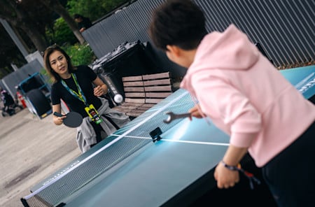 Speed skater Ahenaer Adake was among those to take on Deng Yaping in the table tennis challenge