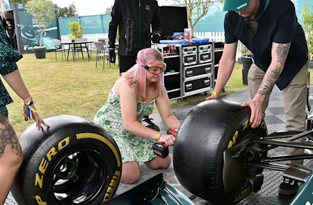 A fan tries out her mechanic skills