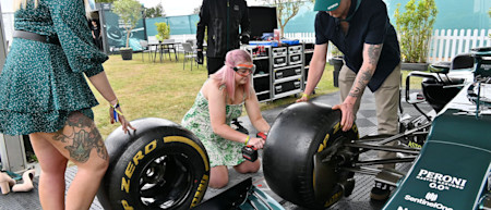 A fan tries out her mechanic skills