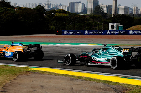 Seb chases the recovering McLaren of Norris.
