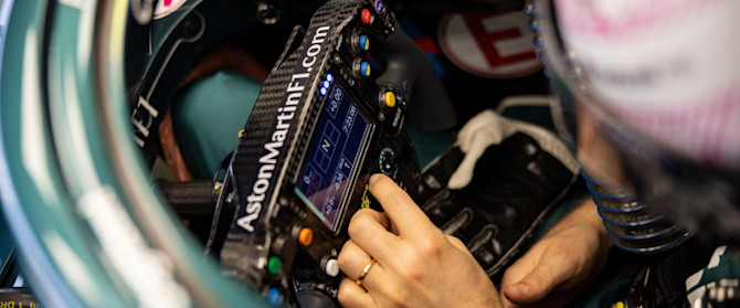 Making adjustments to the AMR21 before going out in Bahrain