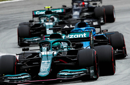 Lance and Sebastian battle in the midfield during the Spanish Grand Prix