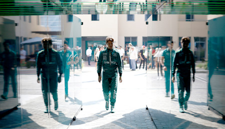 Felipe walks into the garage ahead of FP1